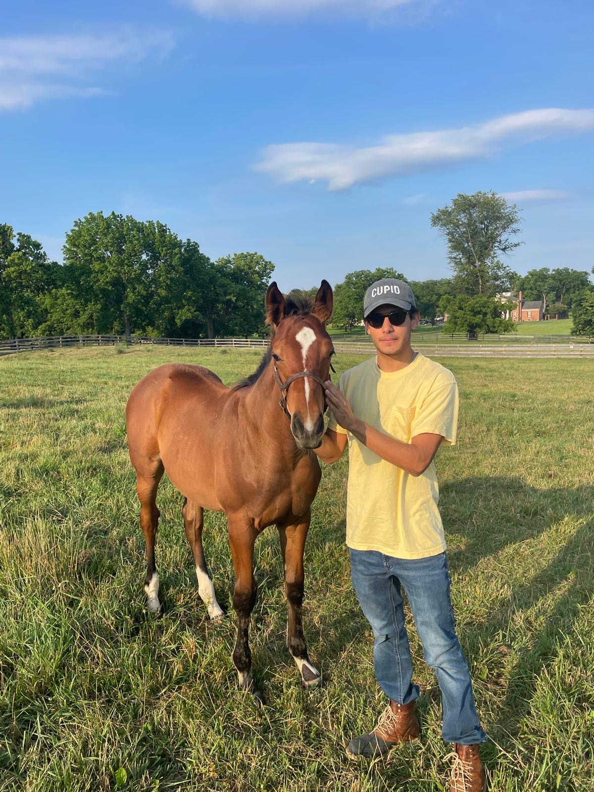 Farm hand with a yearling